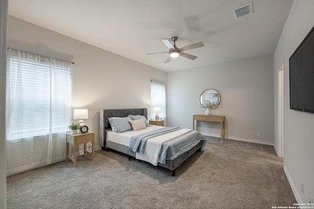 carpeted bedroom with ceiling fan