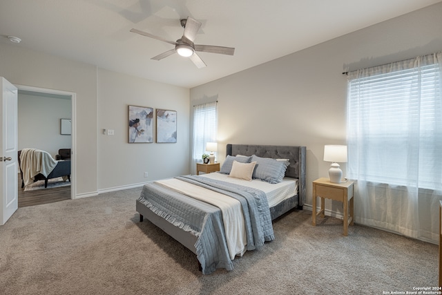 carpeted bedroom with ceiling fan