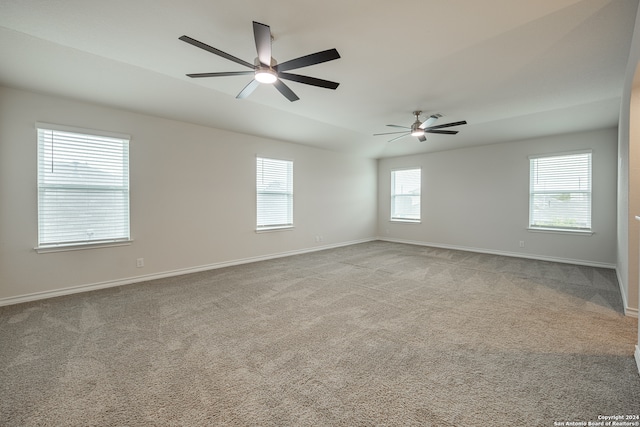 unfurnished room featuring ceiling fan and light carpet