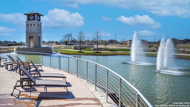 surrounding community featuring a water view