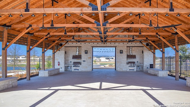 view of patio with an outdoor fireplace, grilling area, and area for grilling