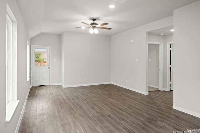 empty room with dark wood-type flooring and ceiling fan