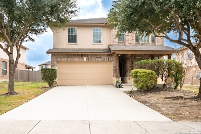 view of front of house featuring a garage and a front lawn