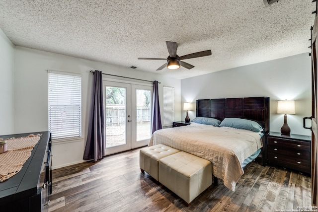 bedroom with french doors, dark wood-type flooring, access to exterior, a textured ceiling, and ceiling fan