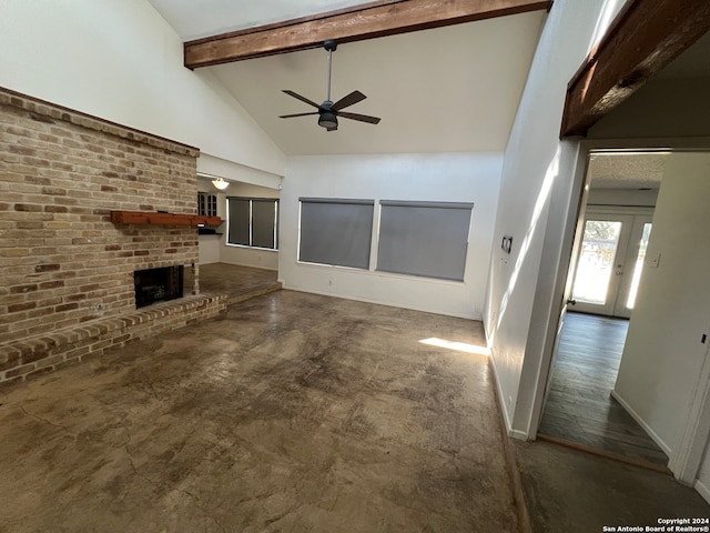 unfurnished living room with a fireplace, high vaulted ceiling, dark wood-type flooring, beamed ceiling, and ceiling fan