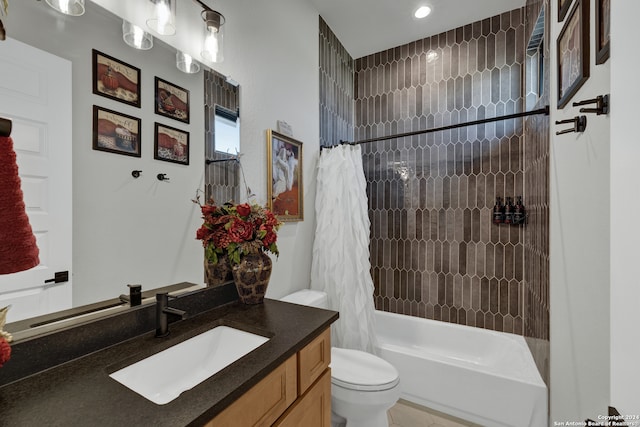 full bathroom with toilet, shower / tub combo, and vanity