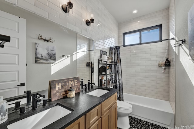 full bathroom featuring shower / bath combo with shower curtain, tile patterned floors, vanity, and toilet