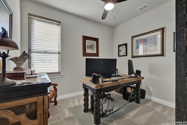 office space with light carpet and ceiling fan