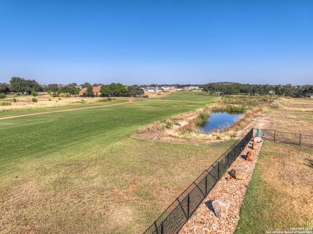 view of home's community featuring a yard and a water view