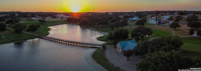 aerial view at dusk with a water view