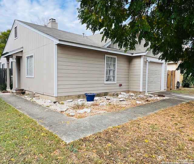 view of side of property featuring a garage