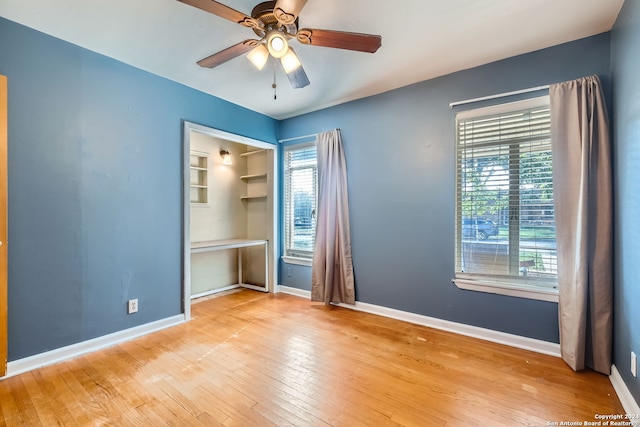 unfurnished bedroom featuring ceiling fan and light wood-type flooring