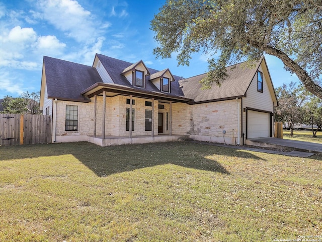 view of front of home featuring a garage and a front yard