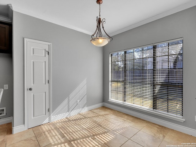 empty room with light tile patterned flooring and crown molding