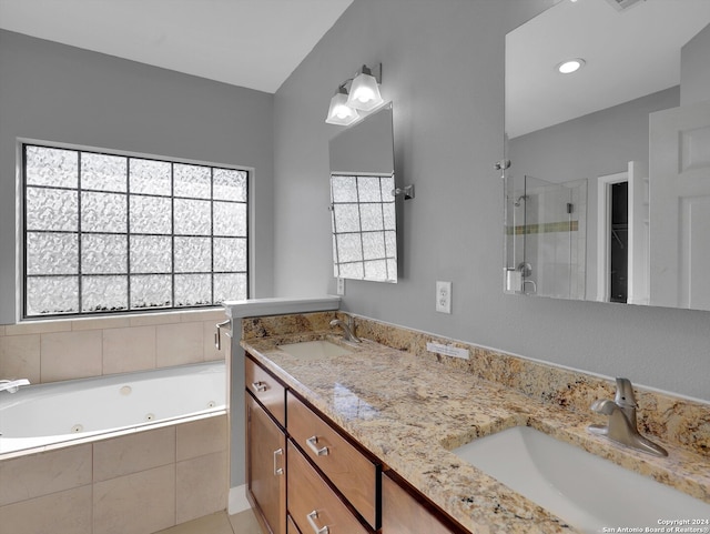 bathroom with vanity, a wealth of natural light, tile patterned floors, and separate shower and tub