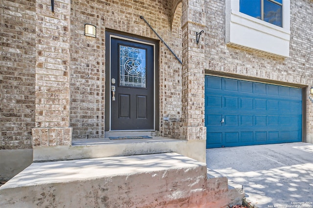 doorway to property featuring a garage