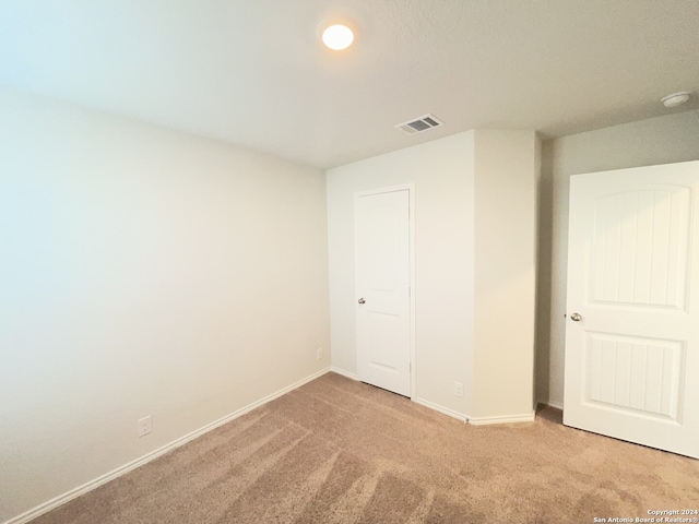 unfurnished bedroom with carpet floors