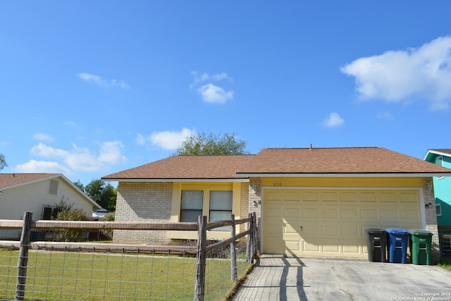 view of front of house with a garage and a front yard