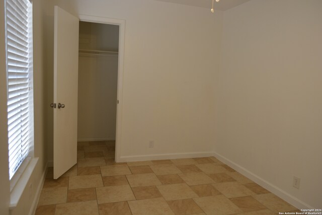 unfurnished bedroom featuring a closet