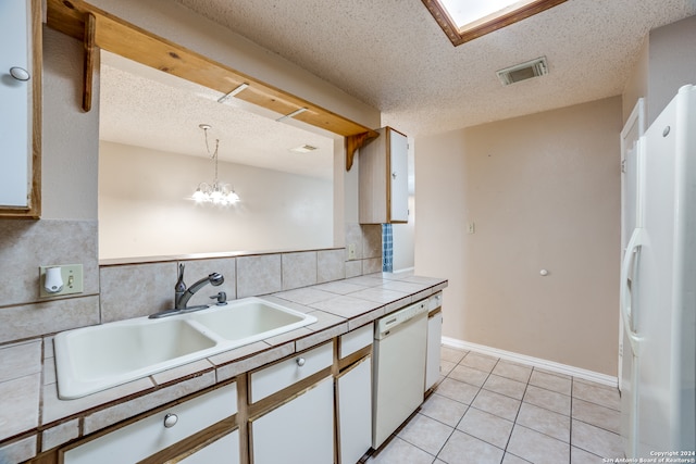 kitchen with tile counters, decorative light fixtures, white cabinets, tasteful backsplash, and white appliances