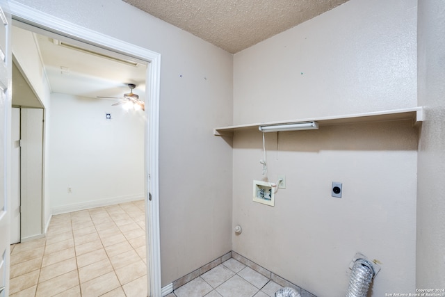 clothes washing area with ceiling fan, a textured ceiling, light tile patterned floors, electric dryer hookup, and hookup for a washing machine