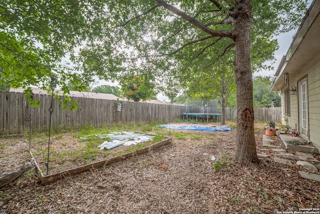 view of yard featuring a trampoline