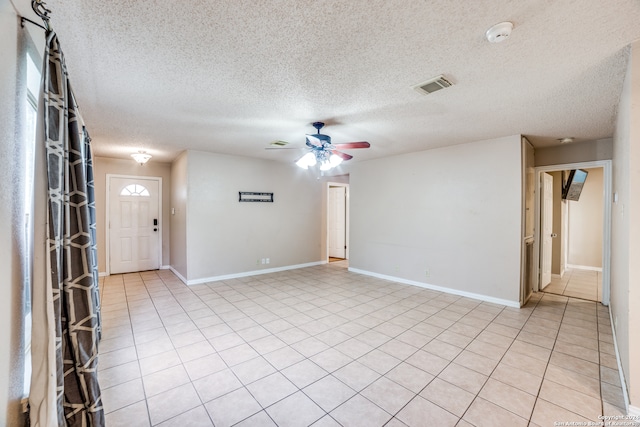 interior space featuring a textured ceiling and ceiling fan