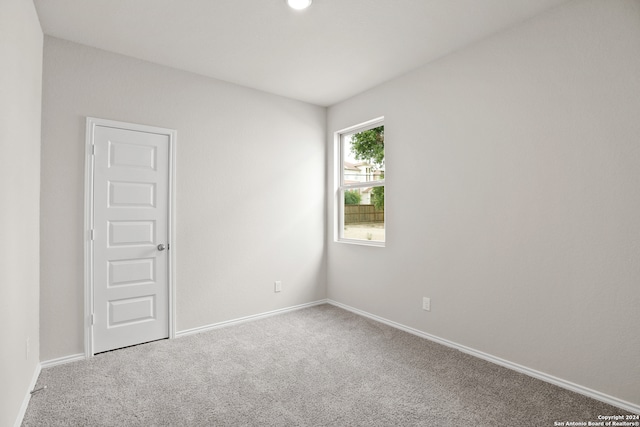 unfurnished room with carpet floors