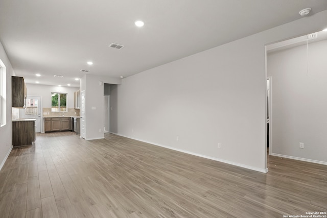 unfurnished living room with wood-type flooring