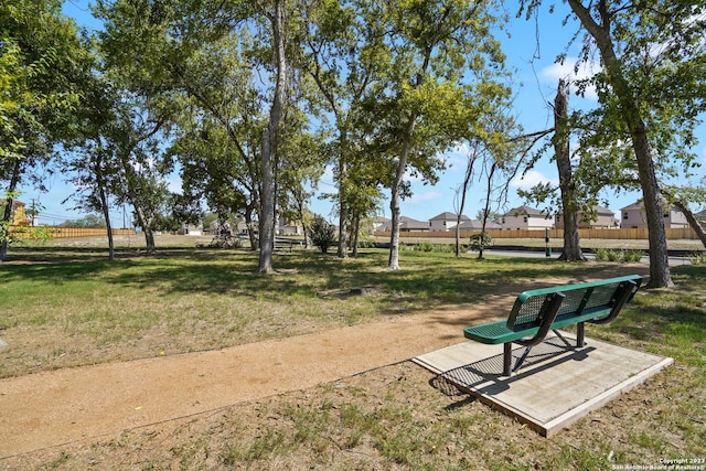 view of property's community featuring a lawn