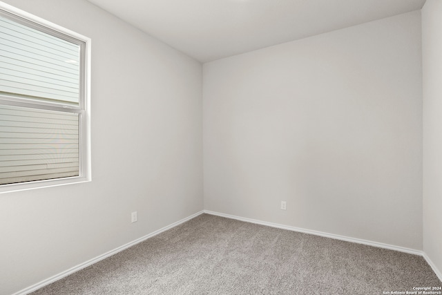 unfurnished room featuring carpet flooring