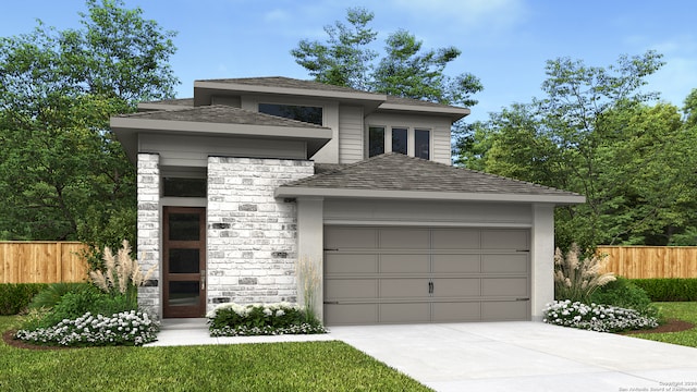 prairie-style home with driveway, stone siding, roof with shingles, an attached garage, and fence