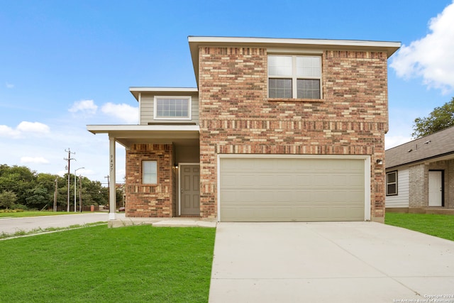 view of front of house featuring a garage and a front yard