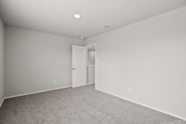 spare room featuring carpet flooring