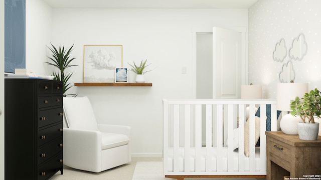 bedroom featuring a crib