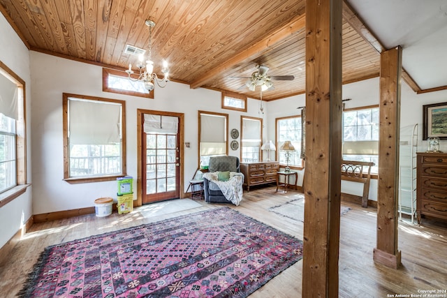 living area featuring lofted ceiling with beams, wooden ceiling, light hardwood / wood-style floors, and ceiling fan with notable chandelier