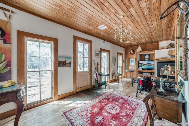 home office featuring wooden ceiling, wood-type flooring, and a notable chandelier