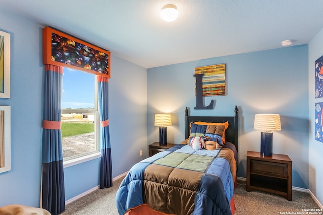 carpeted bedroom featuring multiple windows