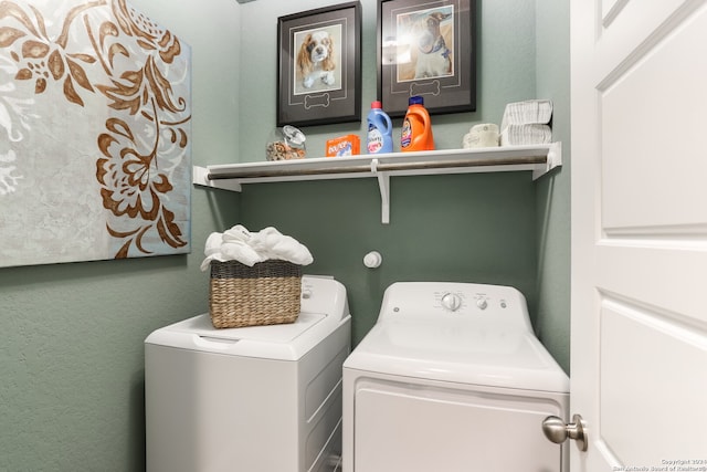 washroom with washing machine and dryer