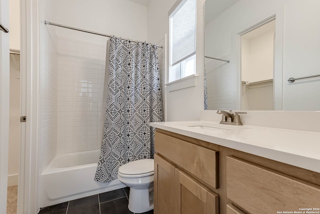 full bathroom featuring toilet, vanity, shower / bath combination with curtain, and tile patterned floors