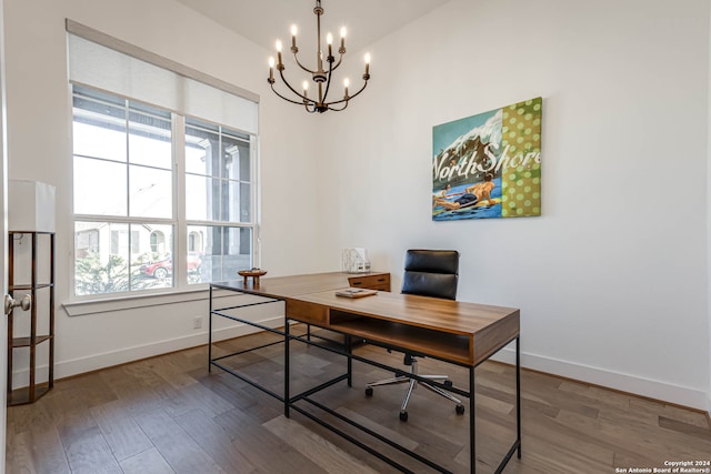 office space with an inviting chandelier and hardwood / wood-style flooring