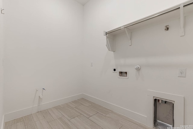 washroom featuring washer hookup, electric dryer hookup, hookup for a gas dryer, and light hardwood / wood-style flooring