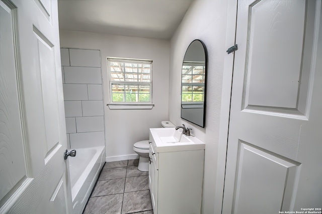 bathroom featuring vanity, tile patterned floors, and toilet