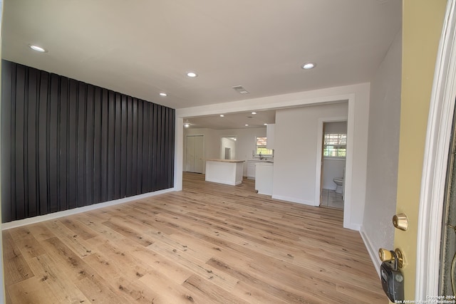 unfurnished living room featuring light hardwood / wood-style floors