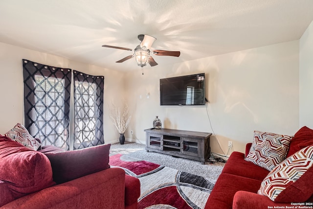 carpeted living room featuring ceiling fan