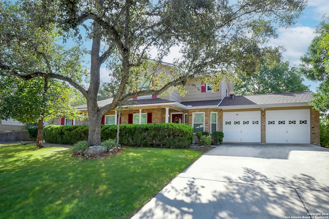 view of front facade with a garage and a front lawn