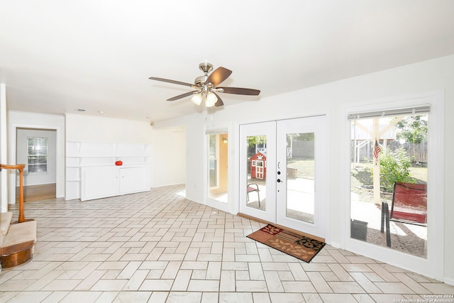 interior space featuring french doors and ceiling fan