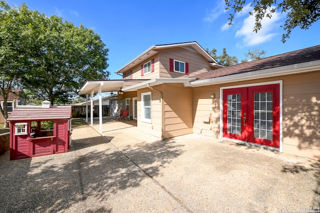 rear view of property with a patio and french doors