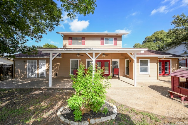 rear view of house with french doors, ceiling fan, and a patio