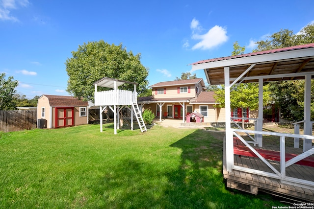 view of yard featuring a storage unit and cooling unit